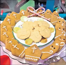  ?? PAT KINCAID ?? Pat Kincaid of Hammond loves to bake, including both shortbread variety, center, and molasses cut-out cookies, outer ring, themed for St. Nicholas served at an annual December event at St. Paul’s Episcopal Church in Munster.