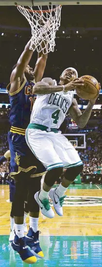  ?? AP ?? Boston Celtics guard Isaiah Thomas (4) drives to the basket during the first quarter of their game against the Cleveland Cavaliers in Boston.