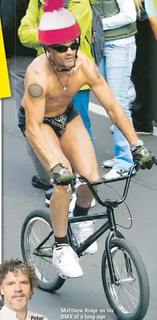  ??  ?? Matthew Ridge on his BMX at a long-ago Boobs on Bikes parade.