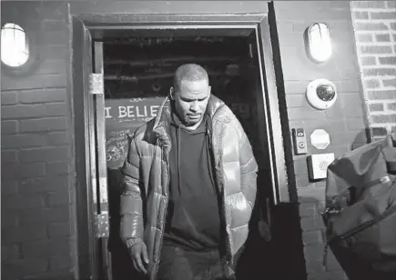  ?? /ABEL URIBE / CHICAGO TRIBUNE ?? Musician R. Kelly emerges from his Chicago studio Feb. 22, 2019, before turning himself in to Chicago police.