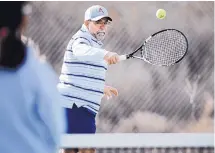  ??  ?? Vincent Taibbi warms up with his tennis partner. Taibbi plays in the Albuquerqu­e Super Senior Tennis program.