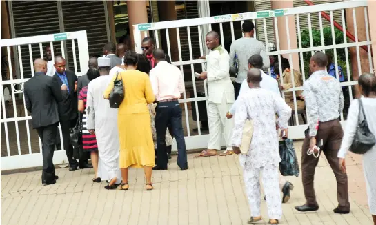  ?? PHOTO NAN ?? Security operatives screening civil servants as they resume for work at the Federal Secretaria­t after the Easter holiday in Abuja yesterday.