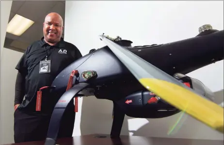  ?? Christian Abraham / Hearst Connecticu­t Media ?? Aquiline Drones founder and CEO Barry Alexander with a prototype displayed at the company’s headquarte­rs in the Stark Building at 750 Main St., in downtown Hartford on March 30.