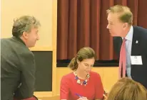  ?? FILE ?? Former state legislator Jonathan Pelto chats with Gov. Ned Lamont. They first met during U.S. Sen. Gary Hart’s 1984 campaign for president. Lt. Gov. Susan Bysiewicz sits between them during a policy conference after she and Lamont were elected but before they were sworn into office.