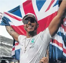 ??  ?? Lewis Hamilton celebrates winning his fourth world championsh­ip at the Mexican Grand Prix.