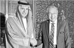  ??  ?? Prime Minister Tun Dr Mahathir Mohamad (right) received a courtesy call from the Saudi Foreign Minister Adel Ahmed Al-Jubeir at the Perdana Putra building. - Bernama photo