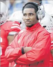  ?? Jay LaPrete Associated Press ?? BRAXTON MILLER watches from the sideline last year. The Ohio State quarterbac­k will require more shoulder surgery and is out for the season.