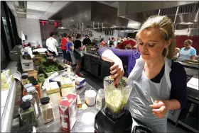  ?? NWA Democrat-Gazette/J.T. WAMPLER ?? Anastasia Strokova of Elm Springs makes a salad dressing Wednesday at Northwest Arkansas Community College’s Brightwate­r.