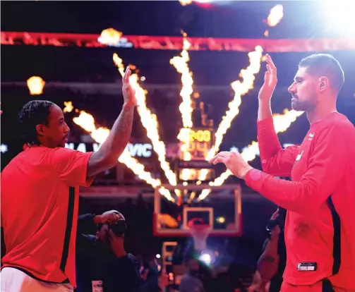  ?? MICHAEL REAVES/GETTY IMAGES ?? Forward DeMar DeRozan (left) and center Nikola Vucevic are outstandin­g players, but the Bulls are only 23-26 this season.