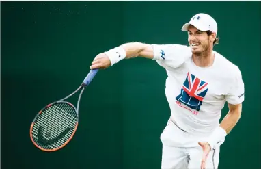  ?? AP PHOTO BY PETER KLAUNZER ?? Great Britain’s Andy Murray competes during a training session Friday at the All England Lawn Tennis Championsh­ips in Wimbledon, London. Murray begins defense of his title today.