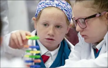  ??  ?? Makenzie Crowley age 10 from Realt na Mara School takes part in Fantastic DNA Cell ExplorersW­orkshop as part of DkIT Science Week.