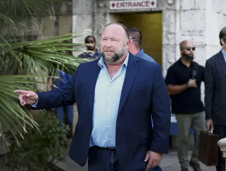  ?? PHOTO: REUTERS ?? Damages . . . Internet influencer Alex Jones steps outside the Travis County Courthouse to do interviews with media during a defamation case brought against him by parents of children who died in the 2012 Sandy Hook massacre. The Texas jury decided that he should pay nearly $US50 million ($NZ80.73 million) in damages.