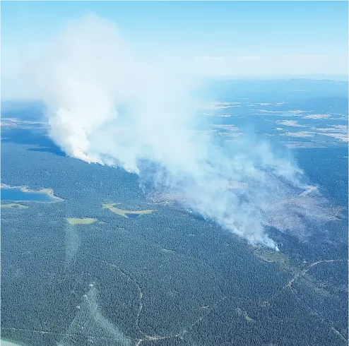  ?? COURTESY OF B. C. WILDFIRE SERVICE ?? Residents of more than 2,000 properties near 100 Mile House were told to evacuate and others were put on alert as a wildfire grows closer. The wildfire broke out Thursday and quickly grew in size to 12 square kilometres.