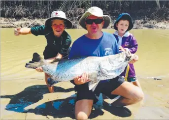  ??  ?? Travis Teichelman and his boys Bryce and Beau enjoyed a day out at Shoal Bay courtesy of Sod’s Barra Safaris, but this 112cm slapper was put back to breed