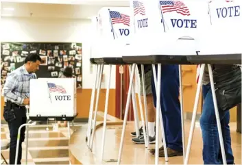  ?? VINCENT OSUNA PHOTO ?? Imperial residents take to the polls to cast their votes in the 2018 Primary Election on Tuesday at T.L. Waggoner Elementary School in Imperial.