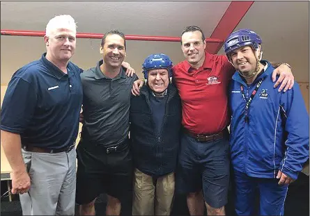  ?? Photo courtesy of Mount St. Charles ?? The new additions to the Mount St. Charles boys' hockey staff stopped by Adelard Arena last week while hockey camp was taking place. Joining longtime MSC coach Bill Belisle, middle, are fresh faces Scott Gainey, far left, Devin Rask, second from left, and Matt Plante, second from right. Gainey, Rask, and Plante all previously worked at Connecticu­t's South Kent School. Also pictured is Peter Belisle, far right.