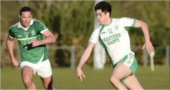  ??  ?? Sean Davey of Curry and Eastern Harps’ Shane O’Grady race for possession in Keash. Pic: Tom Callanan.