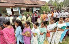  ?? RITU RAJ KONWAR ?? Making it count: Voters waiting to cast their votes in the first phase of Lok Sabha election in Jorhat district of Assam.