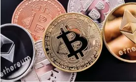  ?? Photograph: Marc Bruxelle/ Alamy ?? Stacked cryptocurr­ency coins such as bitcoin and ethereum.