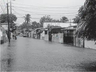  ?? Jose Rodriguez/Tribune News Service ?? Hurricane Fiona brings flooding to Villa Blanca and other parts of Puerto Rico after making landfall at 3:20 p.m. local time Sunday and leaving the island in a general blackout.