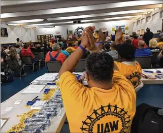  ?? THOMAS GNAU / STAFF ?? Some 200 people attended a United Auto Workers rally Sunday afternoon at the UAW 696 hall in Dayton. Organizers said 75 to 100 Fuyao Glass America workers signed attendance sheets at the meeting. The UAW hopes to organize Fuyao’s plant in Moraine.