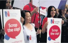  ??  ?? > Nurses staging a protest outside the Department of Health in London last week against the 1% cap on annual pay rises for most NHS staff