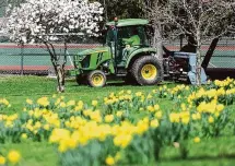  ?? Tyler Sizemore/Hearst Connecticu­t Media file photo ?? A tractor mows the grass at Bruce Park on April 11, 2022.