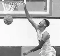  ?? STEPHEN M. DOWELL/ORLANDO SENTINEL ?? Rodney Rhoden dunks against Winter Park in Mainland’s victory in the Rotary Tip-Off Classic on Thursday. Rhoden scored 11 points in the win.