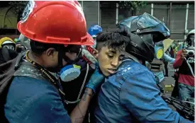  ?? (AFP) ?? This file photo shows an activist receiving assistance during a rally against the government of President Nicolas Maduro, in Caracas on May 18