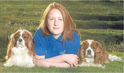  ??  ?? Megan Watson with Cavalier King Charles spaniels Charlie, left and Ruby, who will be accompanyi­ng her to Crufts to represent Scotland in the rally competitio­n. Picture: Paul Reid.