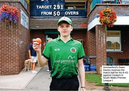  ?? ?? Ammanford’s Owen Davies receives the match ball for his 6-43 against Clydach in South Wales Premier League 1.