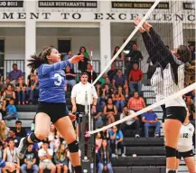  ??  ?? Lady Horsemen senior outside hitter Sierra Moya, left, during an Aug. 24 nondistric­t match at Capital. Moya is one of the top hitters for St. Michael’s.