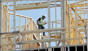  ?? AP file photo ?? An apartment and retail complex takes shape in Nashville, Tenn., in October. Business-equipment investment and housing made a strong contributi­on to the economy’s fourth-quarter expansion.