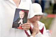  ?? AP Photo/Czarek Sokolowski ?? Catholic faithful attend the beatificat­ion ceremony of Polish Cardinal Stefan Wyszynski and Mother Elzbieta Roza Czacka on Sunday in Warsaw, Poland