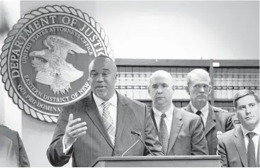  ?? Kathy Willens photos / Associated Press ?? Robert Capers, left, U.S. Attorney for the Eastern District of New York, announces the arrests Thursday of 13 alleged members of the Salvadoran-linked MS-13 gang in connection with the deaths of two teenage girls.