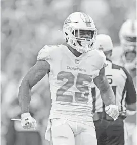  ?? JOHN MCCALL/SUN SENTINEL ?? Dolphins cornerback Xavien Howard celebrates after making a big stop against the Bears in 2018. Howard has dealt with injuries three of the past four seasons.