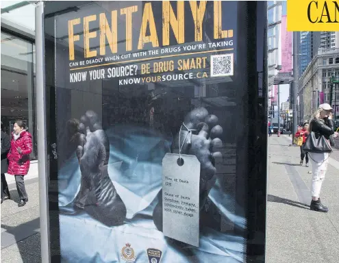  ?? THE CANADIAN PRESS/FILES ?? An anti-fentanyl advertisem­ent is seen in downtown Vancouver last year. New government figures show that nearly 4,000 Canadians died from apparent opioid overdoses last year, with men the most likely victims and fentanyl the clear culprit.