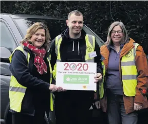  ??  ?? Leek United’s Macclesfie­ld branch manager Veronica McNeil (far left) with fellow volunteers Tom Horsfield and Georgina Timson