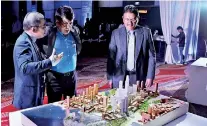  ??  ?? President of the Architects Associatio­n, the Secretary of the Megapolis Ministry and Director Planning of CHEC Port City Colombo discussing the winning idea.