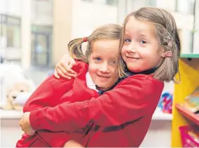  ?? Brown. Pictures: Steven ?? Izzy and Mhairi Stroud are one new set of twins at Burntislan­d Primary, while triplets Lottie, Aidan and Paige Robson enter Aberdour Primary School.