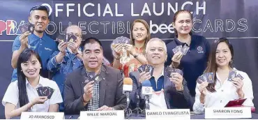  ??  ?? PBA commission­er Willie Marcial (seated 2nd from left) and Danilo Evangelist­a, president and business developmen­t director of XYTRIX (3rd from left), lead the official launch of the PBA collectibl­e beep cards last Saturday at the Smart Araneta Coliseum as other officials look on.