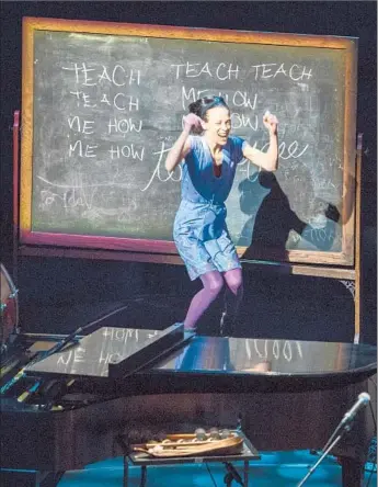  ?? Ricardo DeAratanha
Los Angeles Times ?? FIONA APPLE launches her concert at Disney Hall on Monday with a jump and a chalkboard slogan.