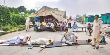  ?? PTI ?? Farmers block the Sonipat-Panipat road during their national shutdown yesterday against three farm reform laws.