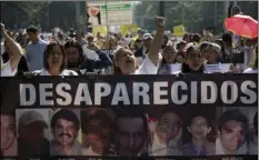  ??  ?? In this May 10 file photo, women carry a banner calling attention to the cases of people who have gone missing in the fight against drug cartels and organized crime, demanding authoritie­s locate their loved ones, as they mark Mother’s Day in Mexico...