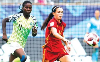  ??  ?? Spain’s Aitana Bonmati (right) outruns Nigeria’s Christy Ucheibe during their quarterfin­al match at the France 2018 Women U-20 World Cup match at the Guy Piriou stadium in Concarneau, western France. Spain beat Nigeria 2-1 to move to the semifinals…yesterday. PHOTO: AFP.