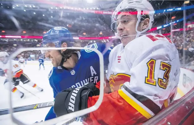  ?? — CP FILES ?? Canucks defenceman Chris Tanev and Flames forward Johnny Gaudreau faced each other in the 2015 playoffs and both remain with their respective teams four years later. But now the Flames are in first place overall in the West and the Canucks are chasing down a wild-card spot.