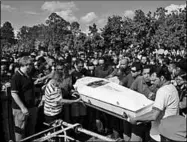  ??  ?? Hundreds of people attend the funeral of one of the victims. (Photo: My Champlain Valley)