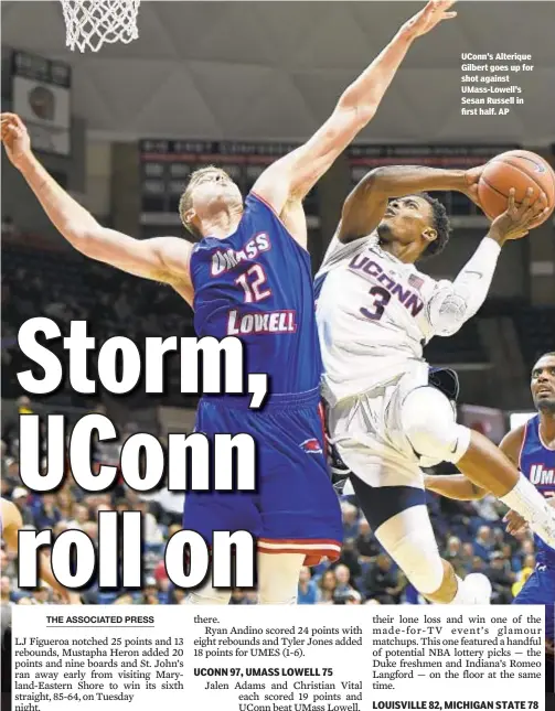  ??  ?? UConn's Alterique Gilbert goes up for shot against UMass-Lowell's Sesan Russell in first half. AP