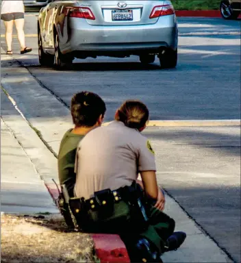  ?? Hayden Trowbridge/ The Signal (See additional photos on signalscv.com) ?? A sheriff’s deputy talks to a boy after a report of a kidnapping in Canyon Country on Tuesday.