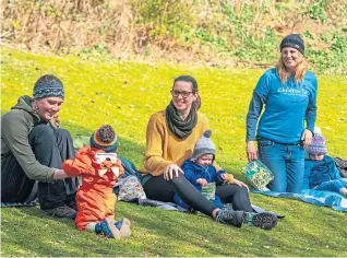  ??  ?? GREAT OUTDOORS: Kiri Stone, front right in picture top left, who formed Wild Fife Babies and Bairns, on a walk with the group at Silverburn Park, Leven.